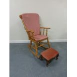 Pine rocking chair with loose cushion pads, together with a upholstered footstool.