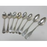 Eight silver tablespoons, six English Hanoverian pattern dating between 1783 and 1809,