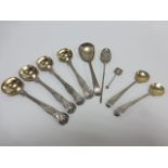 Four Victorian shell back spoons hallmarked London 1859, one 1873,