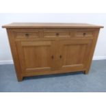 Quality hand crafted oak sideboard with three drawers over a lockable twin door cupboard base,