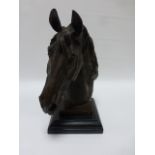 Cast Bronze of a horses head raised on stepped marbled base, 31cm high.