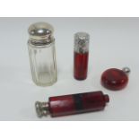 Three Victorian Cranberry glass scent bottles, two with hallmarks for 1887 and 1892,