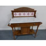 Pine marble topped washstand with decorative tiled gallery,
