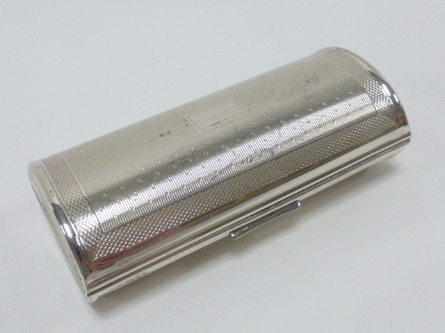 Silver Kigu vanity case with engine turned decoration, hallmarked London 1963, 9cms in length, 69.