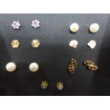 Seven pairs of 9ct gold earrings, for pierced ears, one pair of butterfly backs are missing.