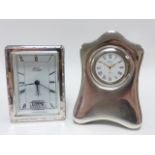 Two R Carr's silver clocks, 12.5 and 10cms in height.