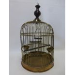 Brass bird cage with perch, swing & two bowl feeders, approximately 59cm high & 34cm diameter.