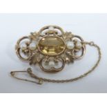 A 9ct gold brooch set with a central faceted citrine stone and pearls, hallmarked London 1966, 3.