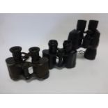 Three pairs of binoculars including a pair of Military WW1 Dollond London Prismatic x 6, BNU5 8x30,