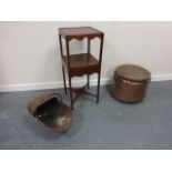 Large fireside twin handled copper pot with wooden lid, raised on three supports,