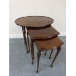 Mahogany nest of three tables, the large