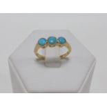 18ct gold ring set with three Turquoise