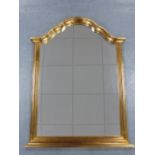 A Gilt framed wall mirror with domed top