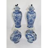 A PAIR OF CHINESE BLUE AND WHITE MOON FLASKS, with fishermen in landscape decoration, with moulded