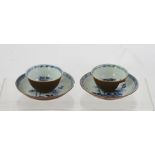 A PAIR OF NANKING CARGO QIANLONG CAFE AU LAIT TEA BOWLS with saucers, interiors painted in