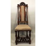 A 17TH CENTURY STYLE CAROLEAN DESIGN HIGH BACK CHAIR having carved scroll crest, upholstered seat