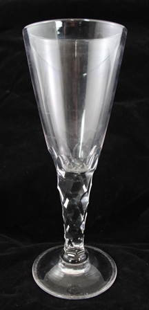 A LATE 19TH CENTURY GOBLET OF LARGE PROPORTION having tapering bowl on facet cut stem and domed