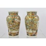 A PAIR OF EARLY 20TH CENTURY SATSUMA EARTHENWARE VASES each oviform profusely decorated in