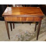 A GEORGIAN MAHOGANY TEA TABLE of simplistic design, having rectangular foldover top, supported on