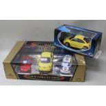 BURAGO GIFT COLLECTION CONTAINING THREE DIE-CAST MODELS 1:24 and 1:18 scale including new VW beetle,