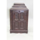 AN EDWARDIAN MAHOGANY TABLE CABINET having carved decoration, fitted single door with plain