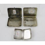 THREE RUSSIAN SILVER CIGARETTE CASES each with engraved decoration, two with polished cabochon inset