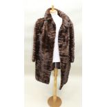 A THREE-QUARTER LENGTH MINK FUR COAT, possibly Russian, and ANOTHER A BOLERO with red tints