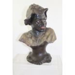 A 19TH CENTURY CONTINENTAL STYLISED HEAD AND SHOULDERS BUST OF A BLACK BOY with hat, impressed