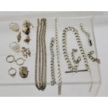 A QUANTITY OF SILVER AND WHITE METAL ITEMS including chains, padlock clasps, charms, etc, 100g