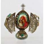 A RUSSIAN STYLE DEVOTIONAL OBJECT IN THE FORM OF A FILIGREE EGG with cross knop, two hinged doors