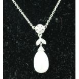 AN 18CT WHITE GOLD DIAMOND AND PEARL PENDANT having single pearl drop, a leaf and flower set,