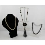 THREE PERIOD FLAPPER NECKLACES comprising; pearls, jet beads and a jet and gilt bead 1920's