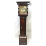 AN EARLY 19TH CENTURY OAK LONGCASE CLOCK having square top hood, square dial with cast spandrels