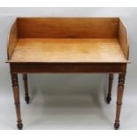 A 19TH CENTURY MAHOGANY WRITING/SERVING TABLE, fitted gallery back, plain frieze, raised on ring