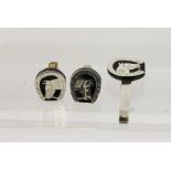 A PAIR OF SILVER MOUNTED CUFF LINKS AND MATCHING TIE PIN with equestrian motifs