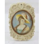 A 19TH CENTURY CARVED IVORY CASED LADY'S POCKET OR HAND LUGGAGE MIRROR, the decoratively carved