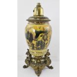 AN EARLY 20TH CENTURY ZSOLNAY EARTHENWARE GILT METAL MOUNTED OIL LAMP, having later electrical