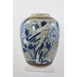 A CHINESE CRACKLE GLAZE JAR, decorated with bird and butterfly in floral scene, 18cm high