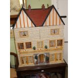A LARGE 20TH CENTURY DOLL'S HOUSE, column flanked entrance complete with furniture, 86cm wide