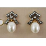 A PAIR OF GOLD COLOURED METAL AND STUD EARRINGS each having a bow set with diamonds and single pearl