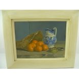 JOHN WHITTALL Still life, oranges and jug, Oil on canvas, signed and dated 1994, in painted plain