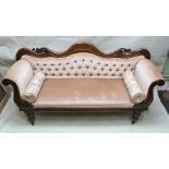 A WILLIAM IV MAHOGANY SCROLL END SOFA with shaped back, having carved acanthus scrolls, button
