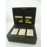 A LATE VICTORIAN LEATHER COVERED TRAVELLING WRITING BOX, opening to reveal compartments, pen tray,