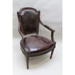 A 19TH CENTURY FRENCH EMPIRE DESIGN CARVED BEECH FRAMED FAUTEUIL, having rope back with acanthus