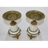 A PAIR OF LATE 19TH CENTURY FRENCH MARBLE AND ORMOLU GARNITURES the dished tops with cast battle
