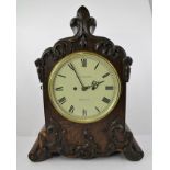 CHAS. DESPREZ - BRISTOL A VICTORIAN OAK AND SIMULATED ROSEWOOD BRACKET CLOCK, having foliate moulded