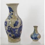 A CHING DYNASTY CRACKLE GLAZE BLUE AND WHITE VASE, decorated with a dragon chasing the flaming