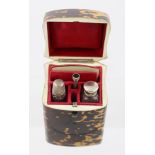 A 19TH CENTURY TORTOISESHELL NECESSAIRE, having hinged cover opening to reveal crimson silk and