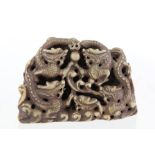 A SUBSTANTIAL CHINESE CHOP/SEAL, decorated with carved dragons and eternal pearl, inscribed on