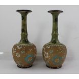 A PAIR OF DOULTON LAMBETH SLATERS PATENT STONEWARE VASES each with green glazed bottle neck, painted